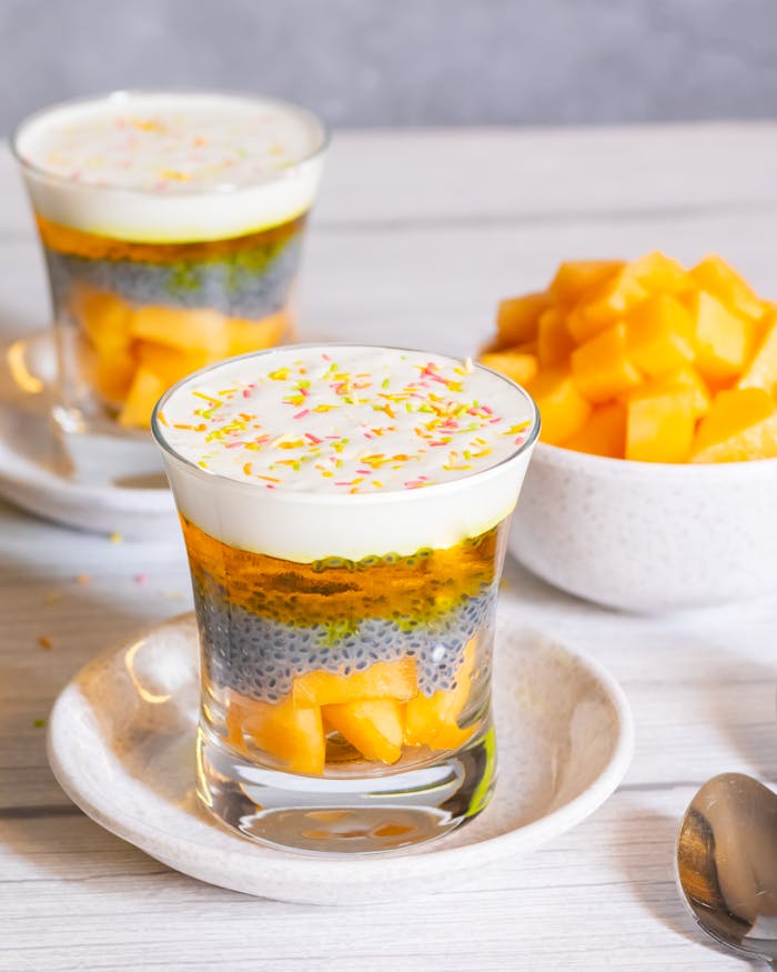 services-04 Delicious chia pudding layered with mango and yogurt, perfect for a healthy breakfast or dessert.